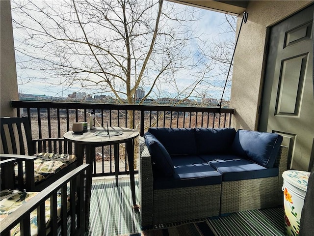 wooden terrace featuring an outdoor living space