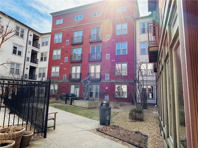 view of property's community featuring visible vents and fence