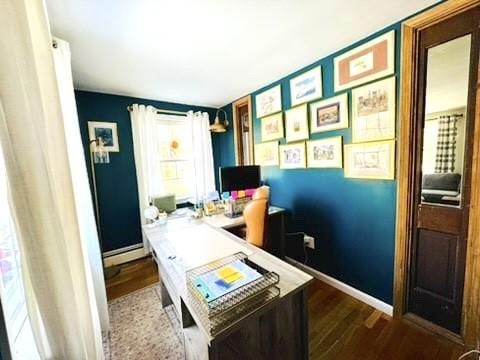 office area with baseboards and wood finished floors