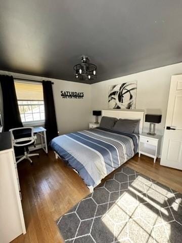 bedroom featuring wood finished floors