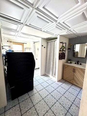 interior space with an ornate ceiling, vanity, and a shower with curtain