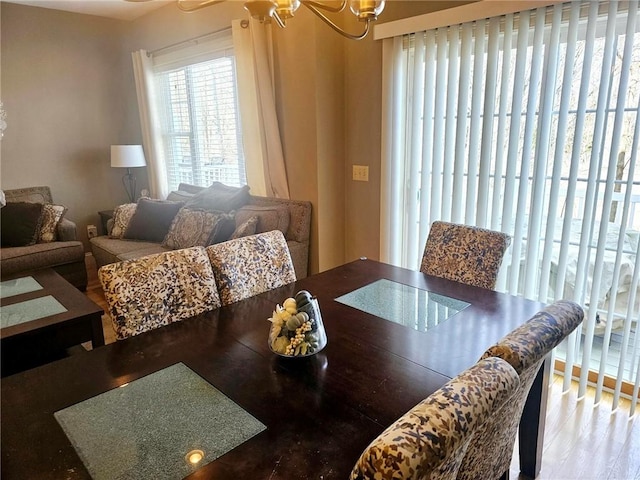 dining room featuring a chandelier and wood finished floors