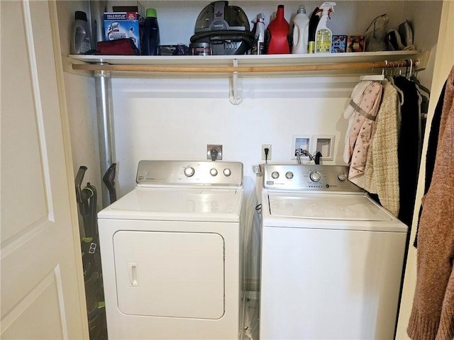 washroom with washing machine and dryer and laundry area