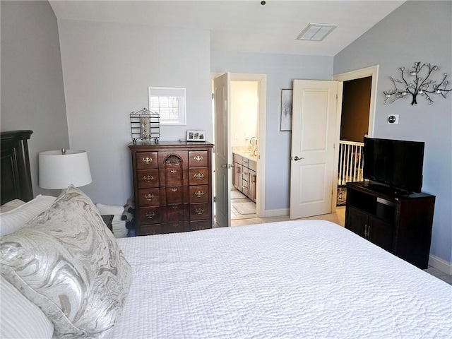 bedroom with visible vents, lofted ceiling, and baseboards