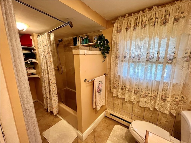 full bath featuring tile patterned flooring, toilet, and baseboard heating