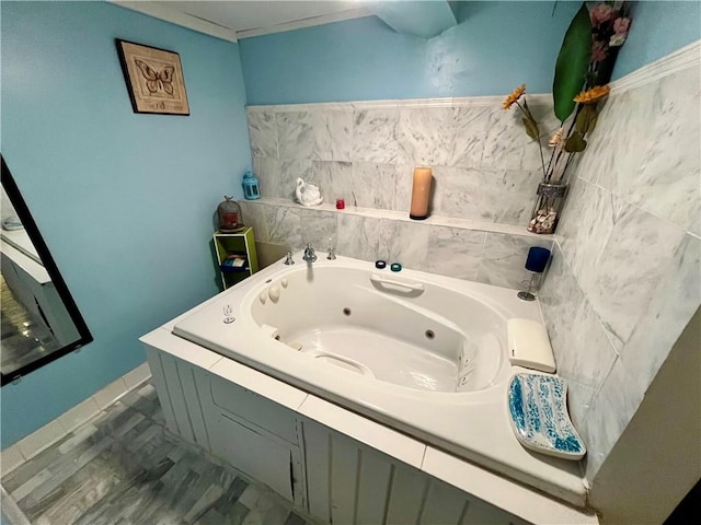 bathroom featuring a tub with jets