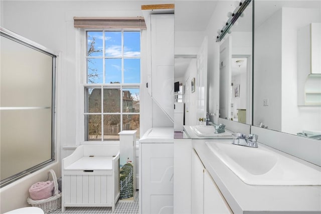 full bathroom featuring vanity and washer / clothes dryer