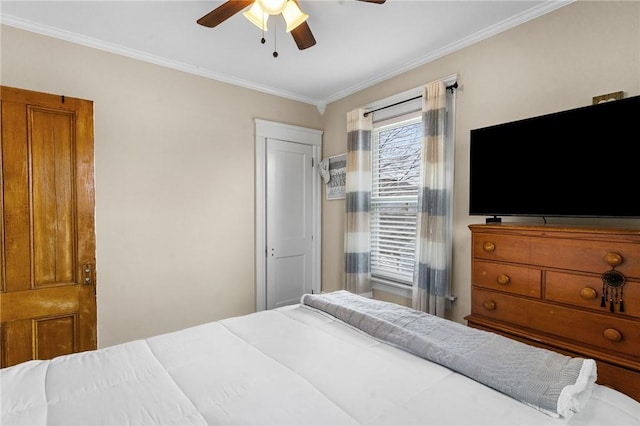 bedroom featuring ornamental molding and a ceiling fan