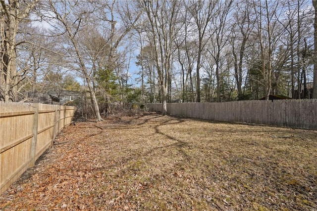 view of yard with a fenced backyard