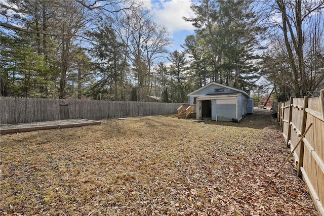 view of yard featuring an outdoor structure, a fenced backyard, and a storage shed