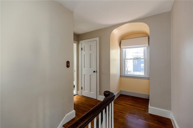 hall with wood finished floors and baseboards