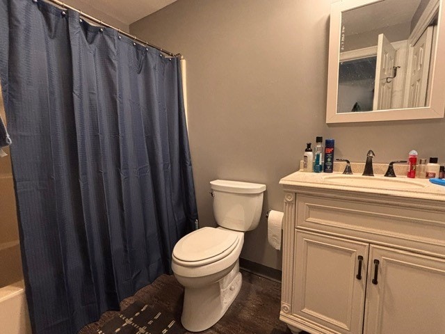 full bath with vanity, toilet, wood finished floors, and baseboards