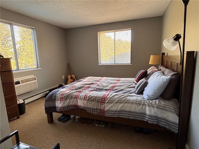 carpeted bedroom with a wall unit AC, a baseboard radiator, and a textured ceiling