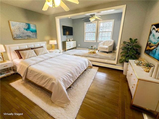 bedroom with a ceiling fan and wood finished floors