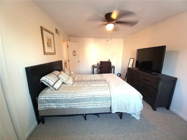 bedroom with carpet flooring, ceiling fan, baseboards, and visible vents