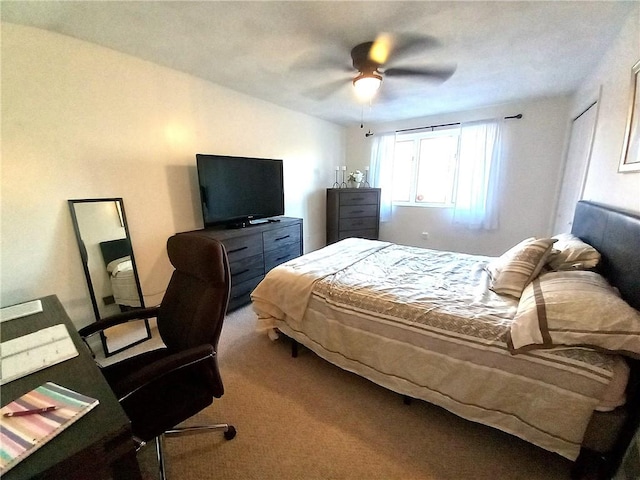 carpeted bedroom with a ceiling fan