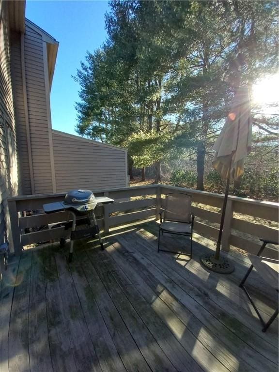 wooden deck featuring grilling area