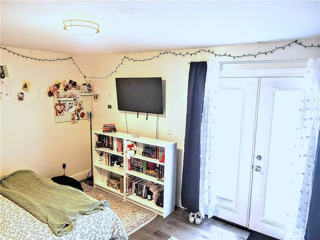 bedroom featuring a closet and wood finished floors