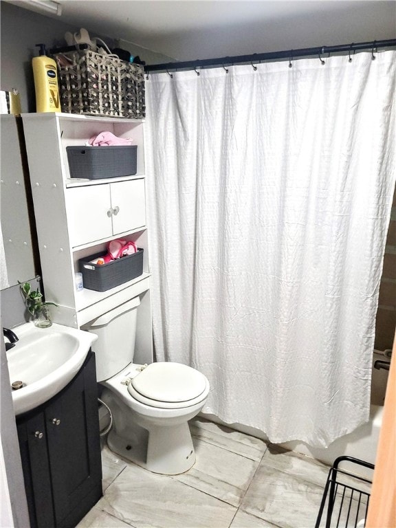 full bathroom featuring toilet, vanity, and shower / bath combination with curtain