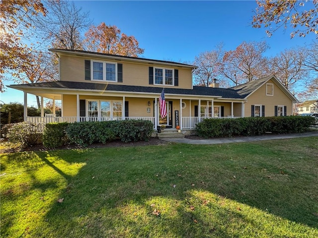 country-style home with covered porch and a front yard