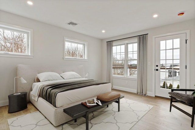 bedroom featuring recessed lighting, visible vents, baseboards, and light wood finished floors