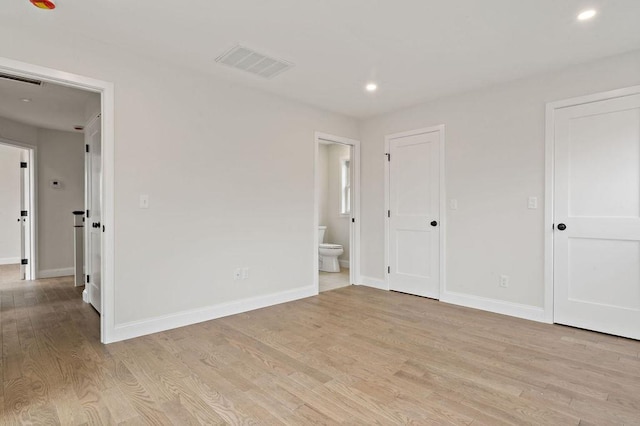 empty room with visible vents, recessed lighting, baseboards, and light wood-style floors