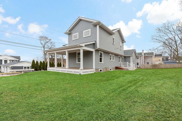 back of house featuring a yard