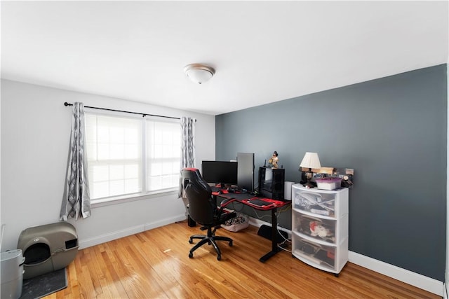 office with baseboards and wood finished floors