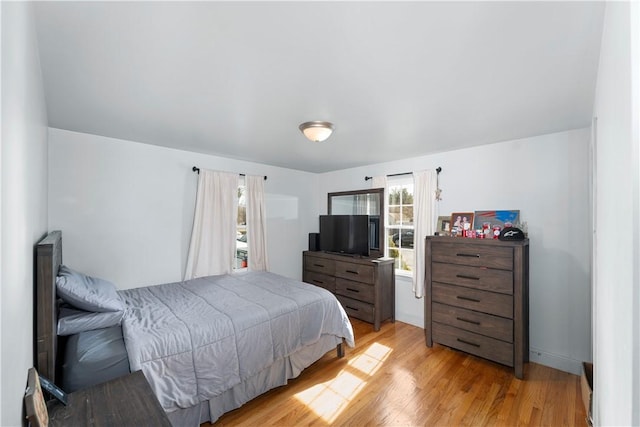 bedroom featuring light wood finished floors