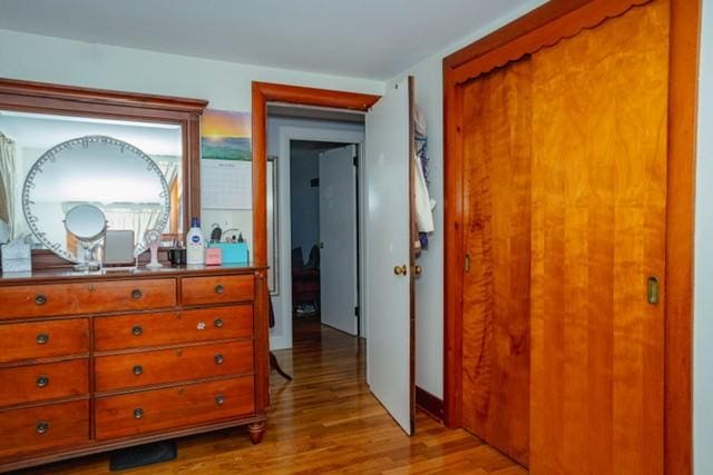 bedroom with a closet and wood finished floors