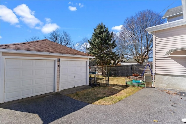 detached garage with fence