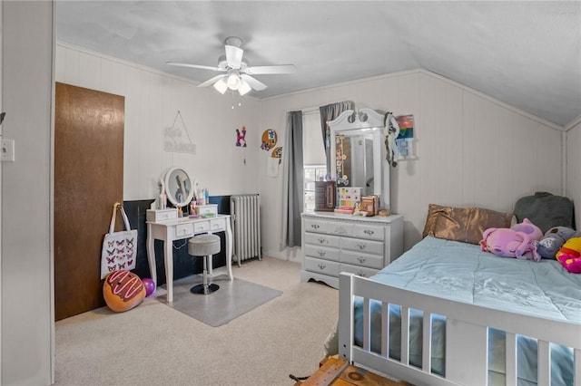 bedroom with lofted ceiling, radiator, ceiling fan, and carpet flooring