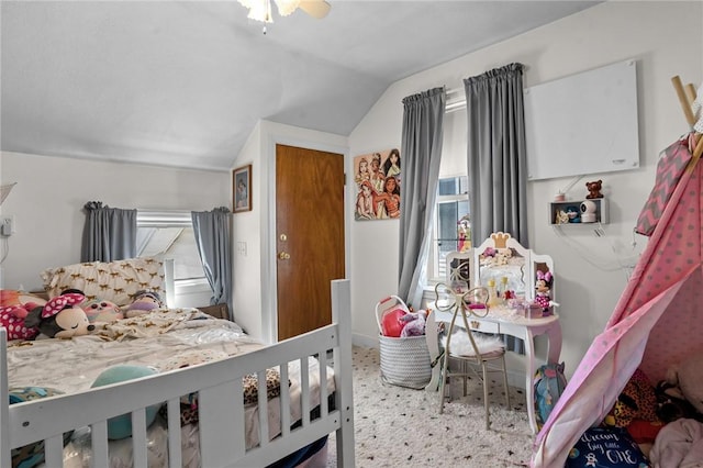 bedroom with ceiling fan and vaulted ceiling