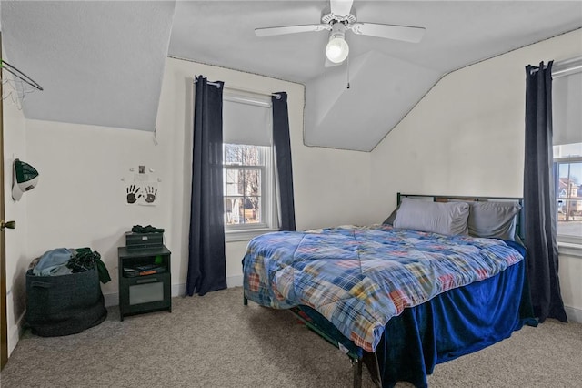 bedroom with carpet flooring, ceiling fan, and lofted ceiling