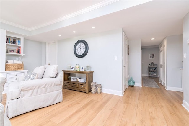 interior space featuring crown molding, recessed lighting, baseboards, and light wood finished floors