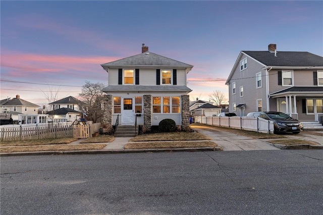 view of front of house with fence