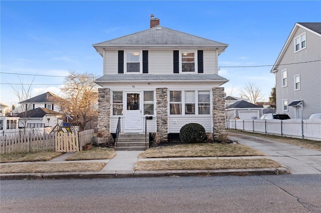 view of front facade with fence, driveway, a shingled roof, entry steps, and a chimney