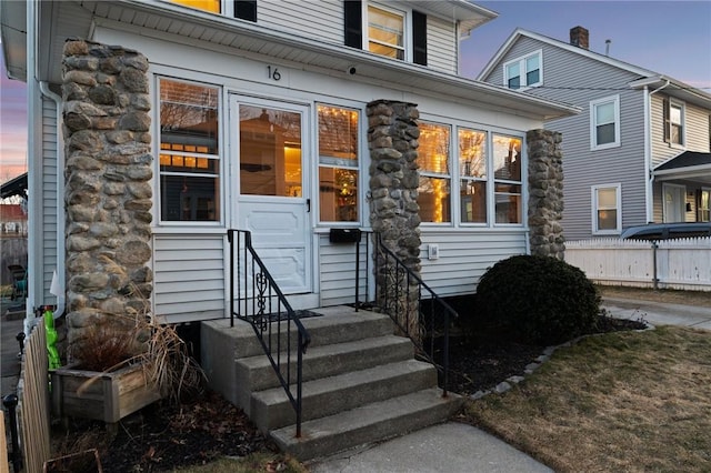 entrance to property with stone siding