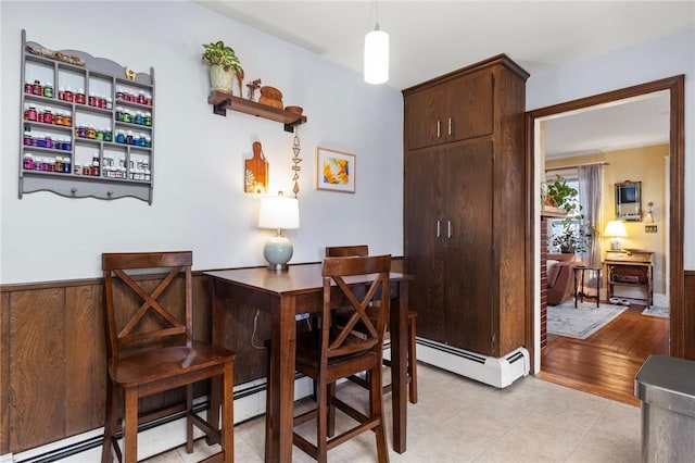 dining area featuring baseboard heating