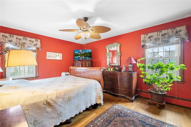 bedroom featuring hardwood / wood-style flooring and ceiling fan