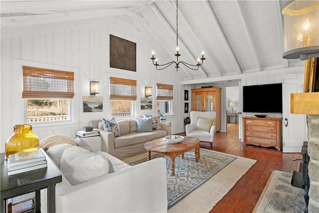 living area with an inviting chandelier, dark wood-type flooring, beamed ceiling, and high vaulted ceiling