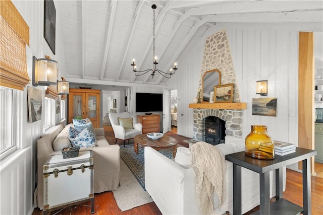 living area featuring a chandelier, beamed ceiling, high vaulted ceiling, and wood finished floors