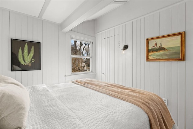 bedroom featuring beam ceiling