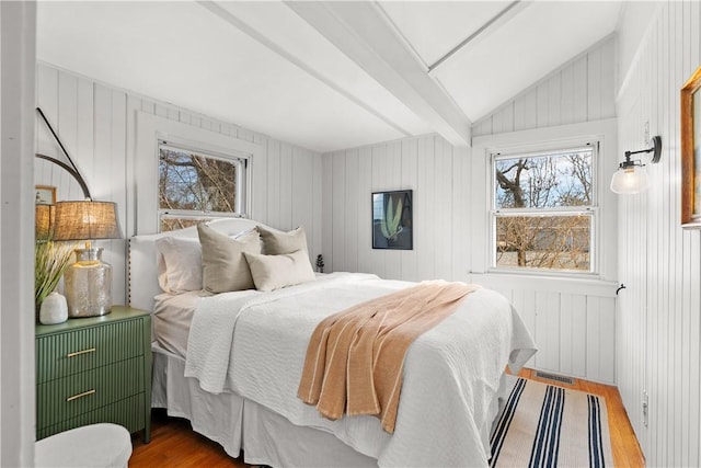 bedroom featuring vaulted ceiling and wood finished floors