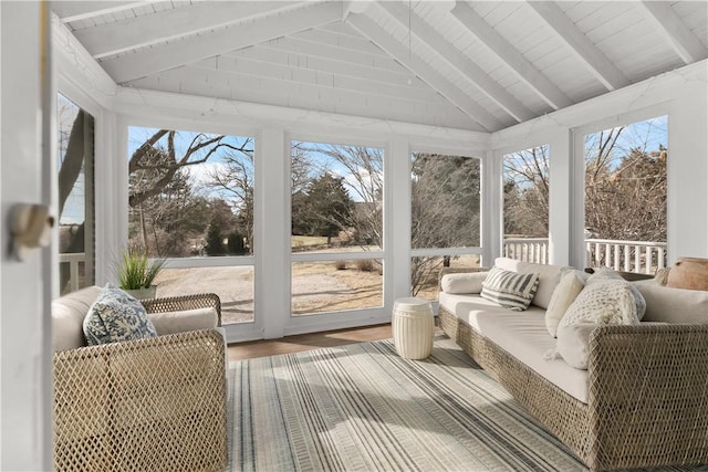 sunroom / solarium with lofted ceiling with beams