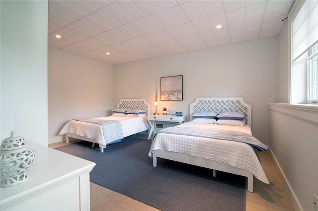 bedroom featuring recessed lighting and baseboards