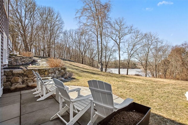 view of patio with a water view