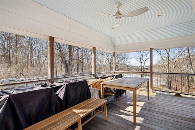 wooden deck featuring ceiling fan