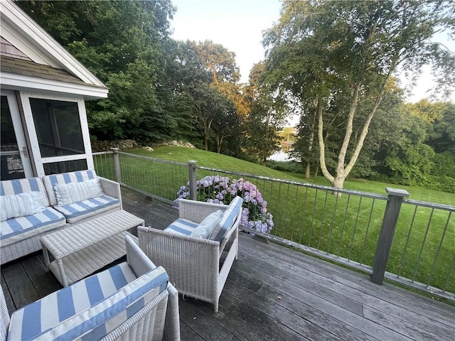 deck with an outdoor living space, a yard, and a sunroom