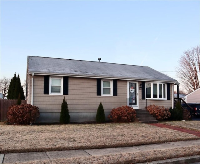 single story home with fence